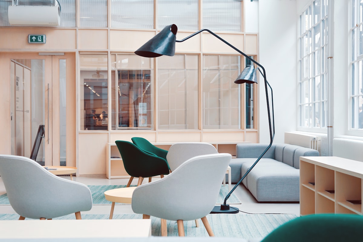 A cozy business nook with a desk, books and warm light